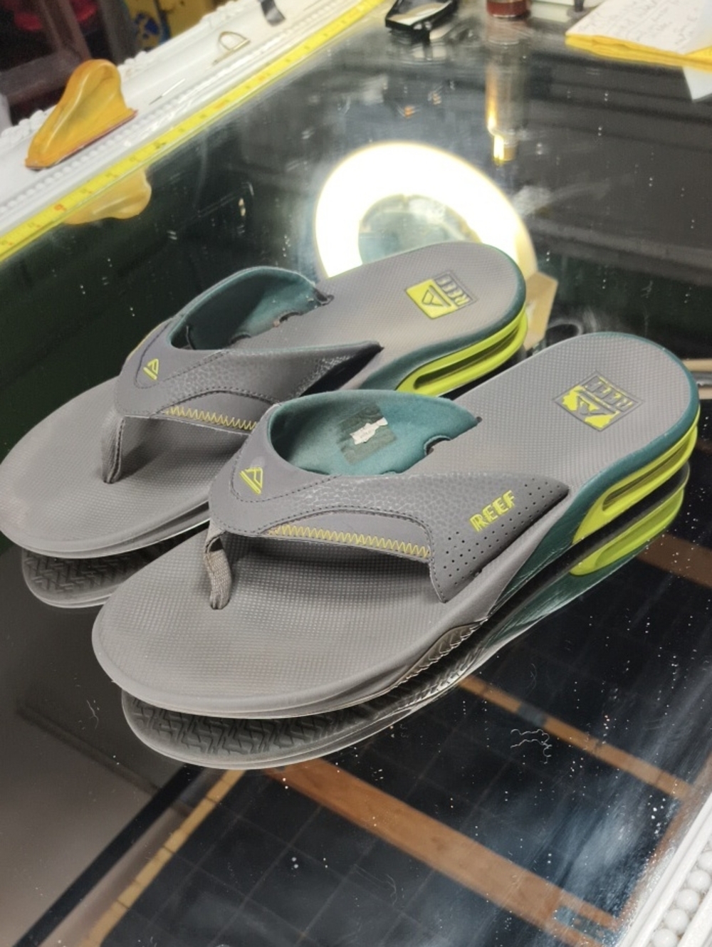 Mens 12 REEF Men's Fanning Thong Sandals featuring a built-in bottle opener.